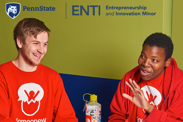 Students from entrepreneurship and innovation minor sit at a table