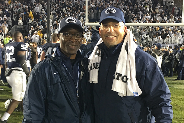 Conrad Tucker poses for photos with Penn State football coach James Frankling
